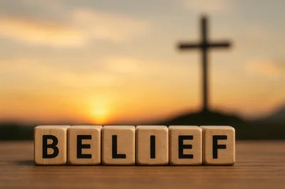 Wooden Blocks Spelling Belief With A Cross Silhouette
