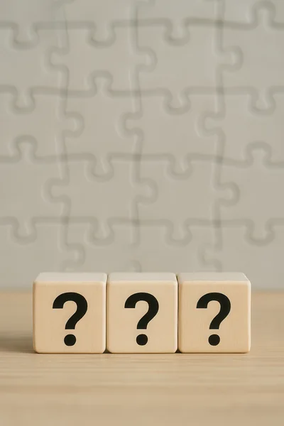 Three Wooden Blocks With Question Marks