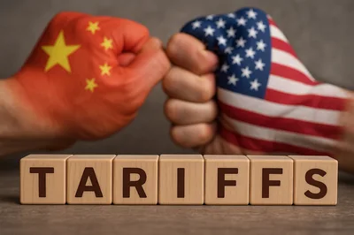 Fists Painted With Chinese And American Flags Facing Off