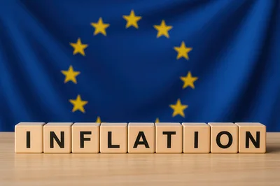 Wooden Blocks Spelling Inflation Against European Union Flag