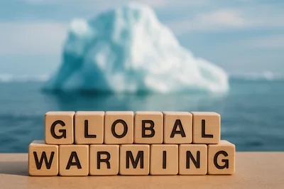 Wooden Blocks Spelling Global Warming With Iceberg Background