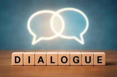 Wooden Blocks Spelling Dialogue With Glowing Speech Bubbles