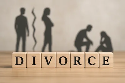 Wooden Blocks Spelling Divorce With Silhouette Figures