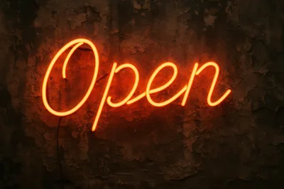 Glowing Orange Neon Open Sign On Textured Wall