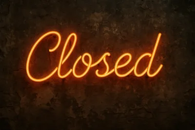 Glowing Orange Neon Closed Sign On Dark Textured Wall