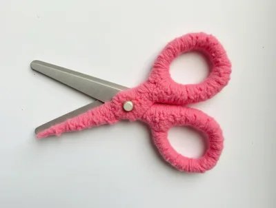 Pink Yarn Wrapped Scissors on White Background