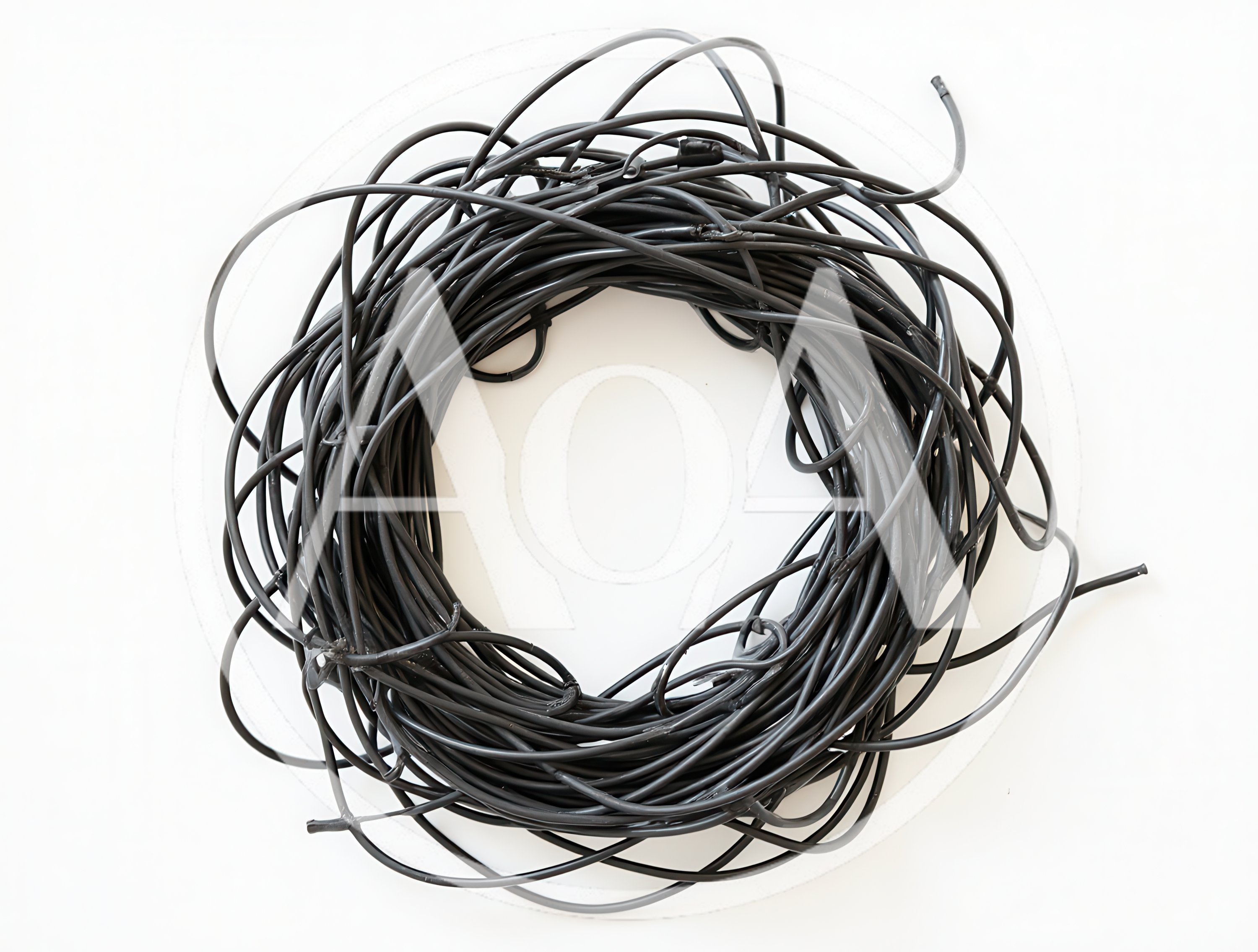 Coiled Black Electrical Wire On White Background
