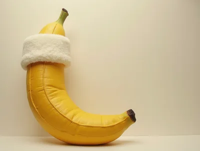 Inflatable Banana Wearing A White Fuzzy Headband