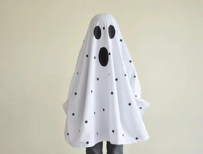 Child Dressed In A Polka Dot Ghost Costume