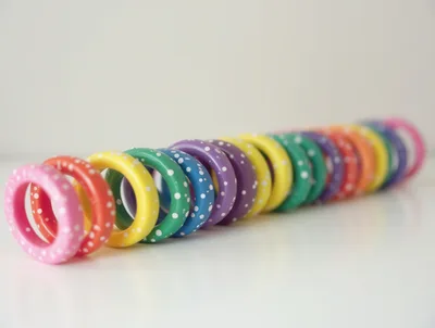 Row Of Colorful Polka Dot Wooden Rings