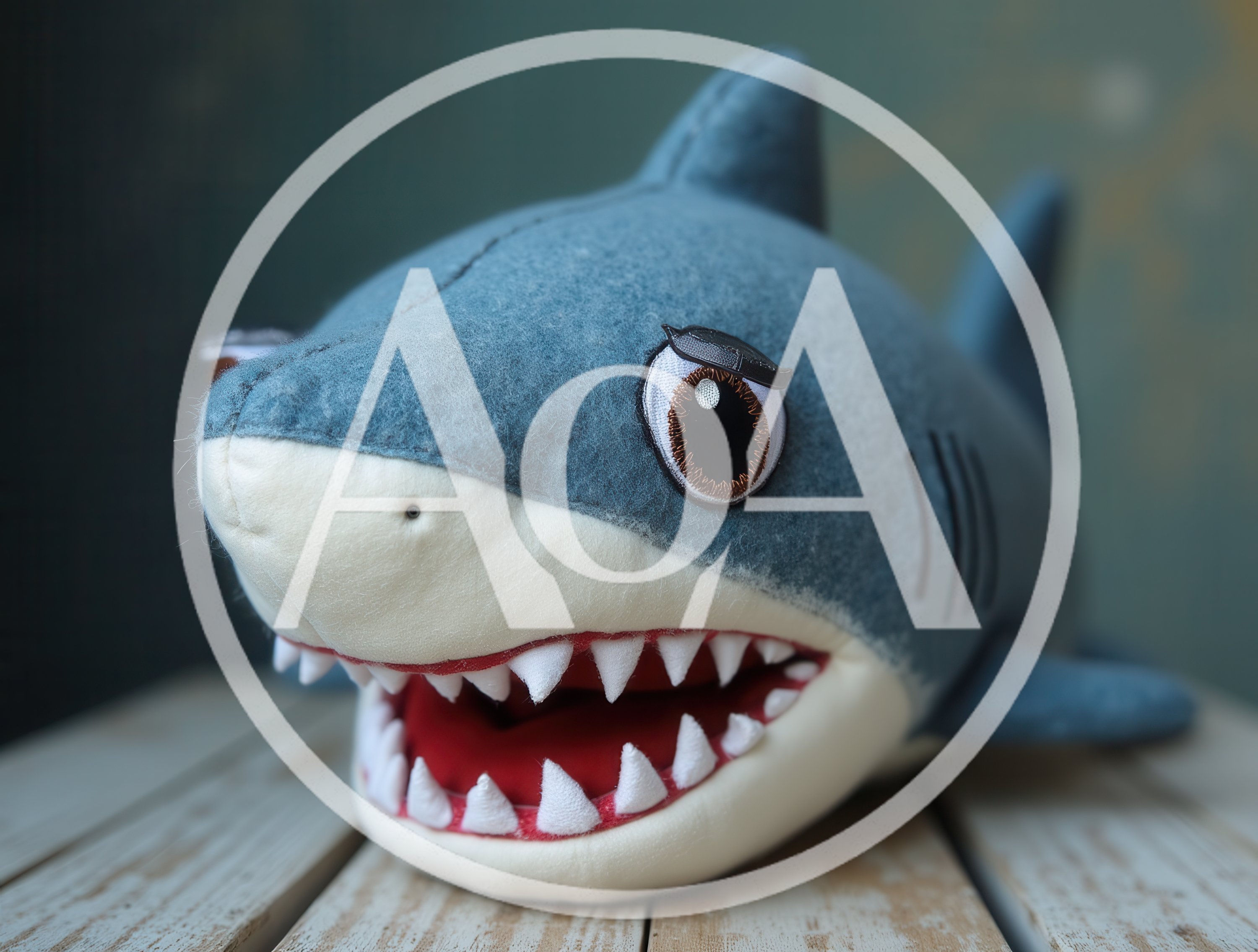 Plush Shark Toy With Open Mouth On Wooden Surface