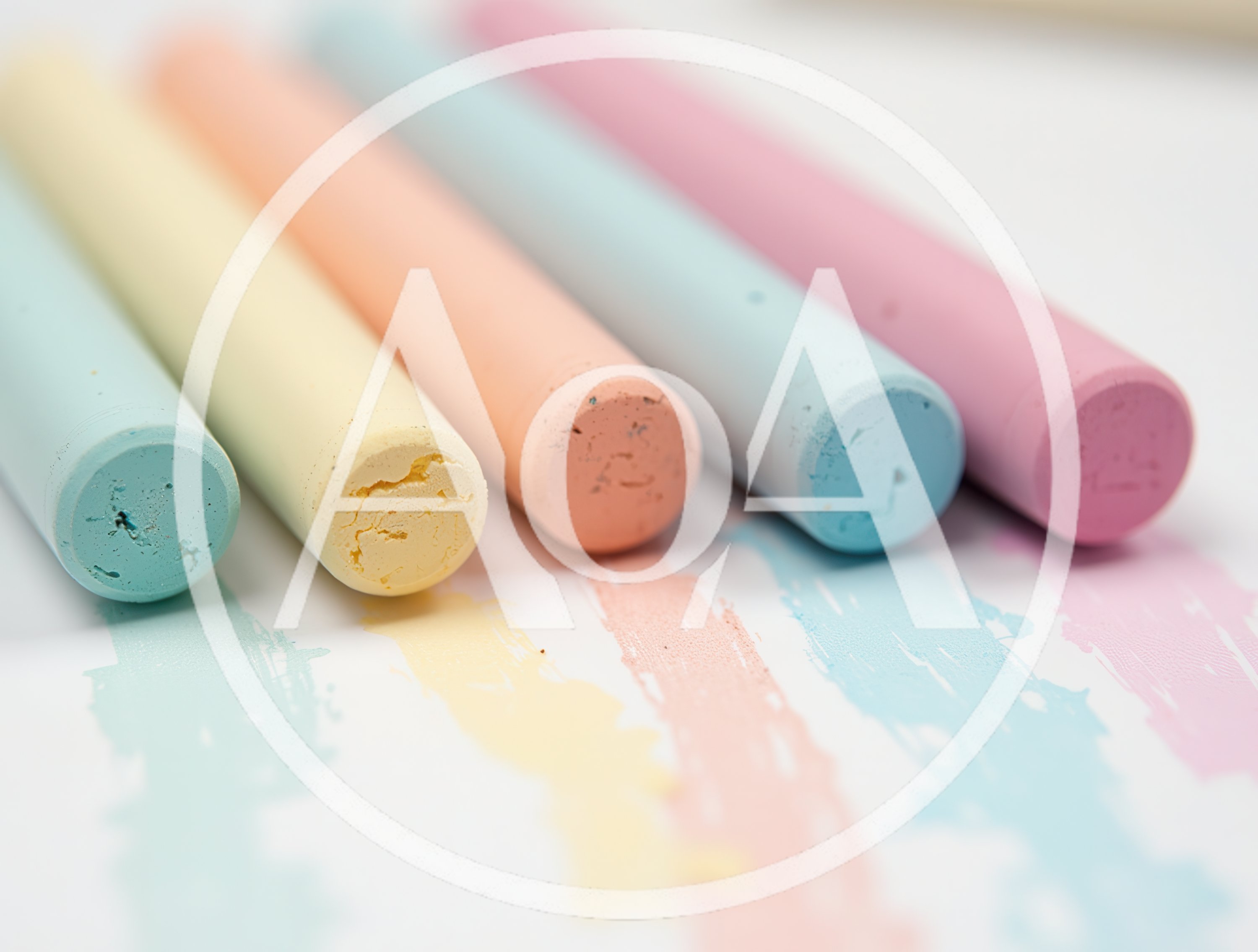 Pastel Colored Chalk Sticks Arranged On White Paper