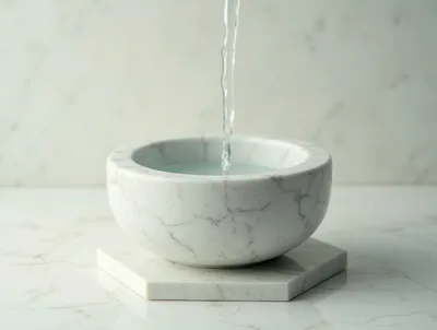Water Pouring Into A Marble Bowl