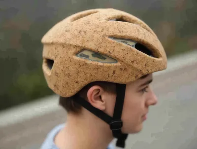 Young Boy Wearing A Textured Cork Bicycle Helmet