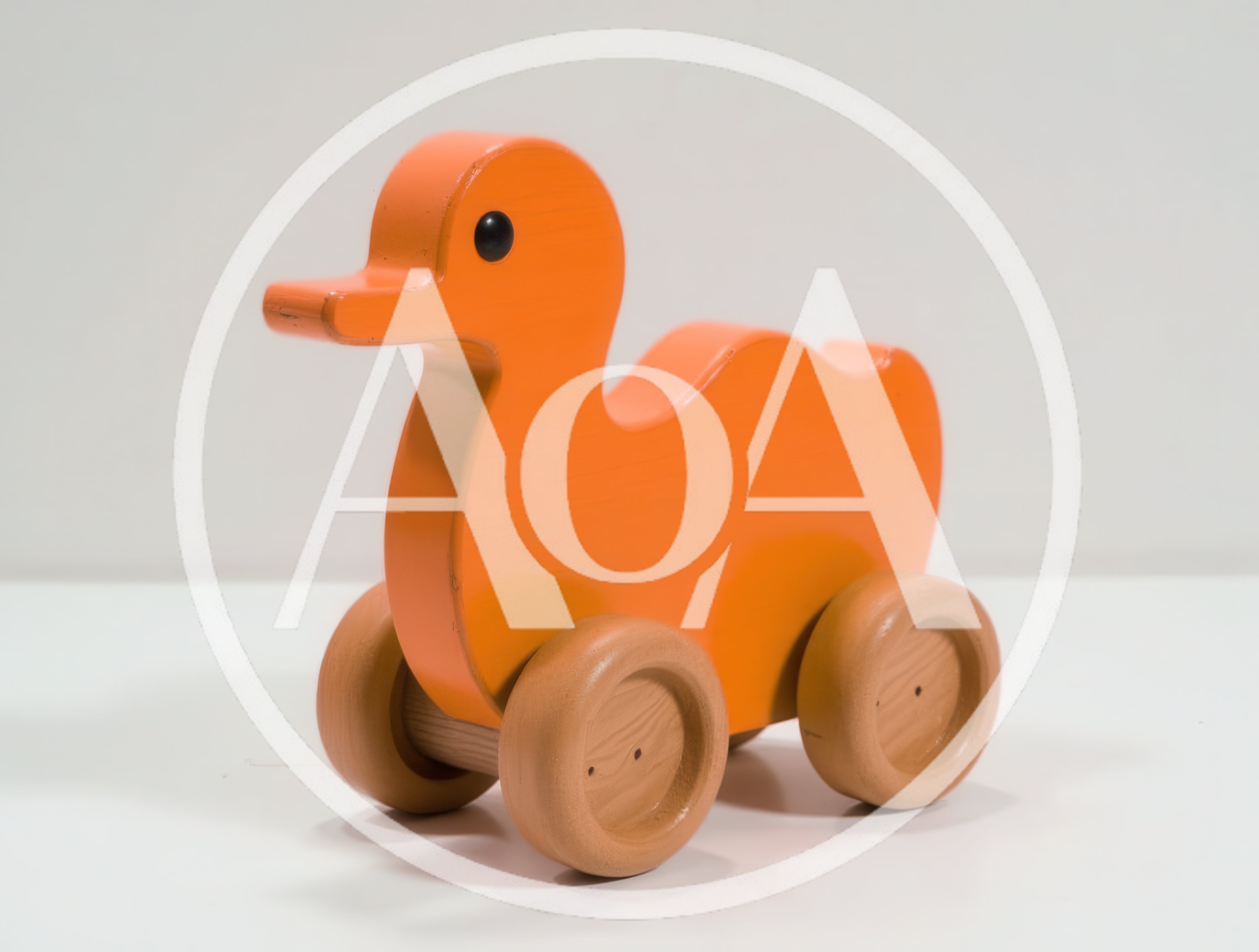 Orange Wooden Duck Toy On Wheels