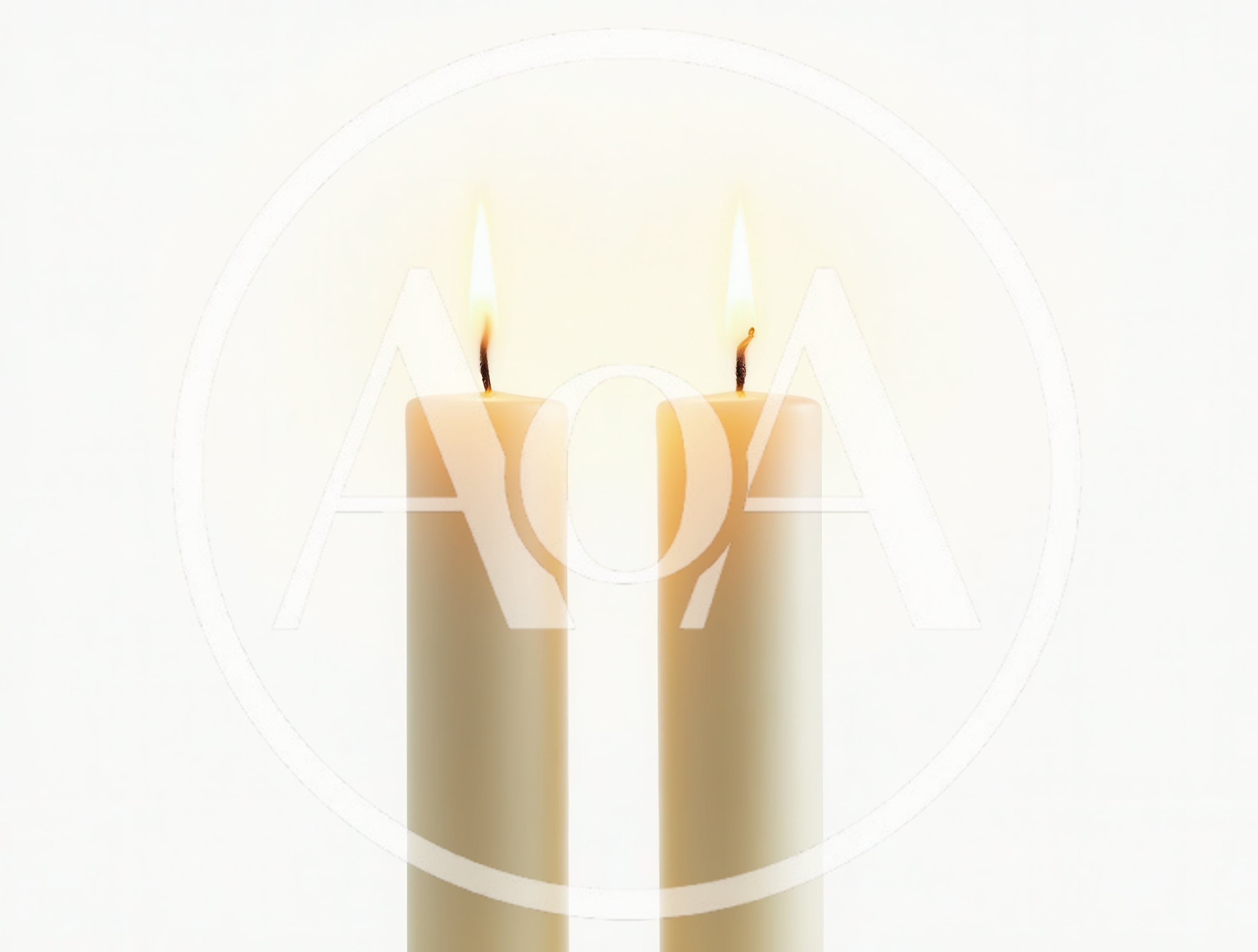Two Lit White Candles Against A Plain Background