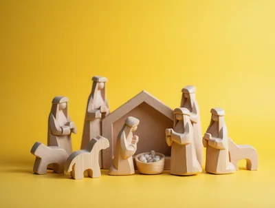 Wooden Nativity Scene Figurines On Yellow Background