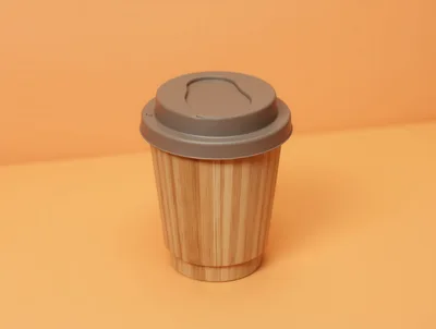 Bamboo Coffee Cup With Lid On Orange Background