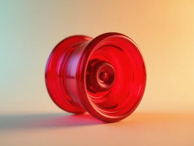 Red Translucent Yo-Yo Resting On A Gradient Background