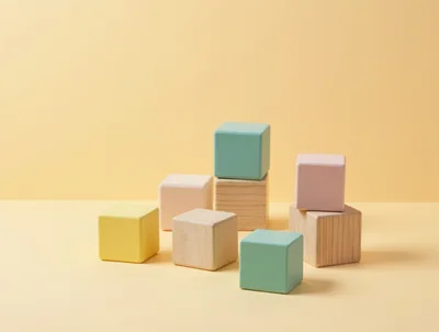 Colorful Wooden Blocks Arranged On A Yellow Background