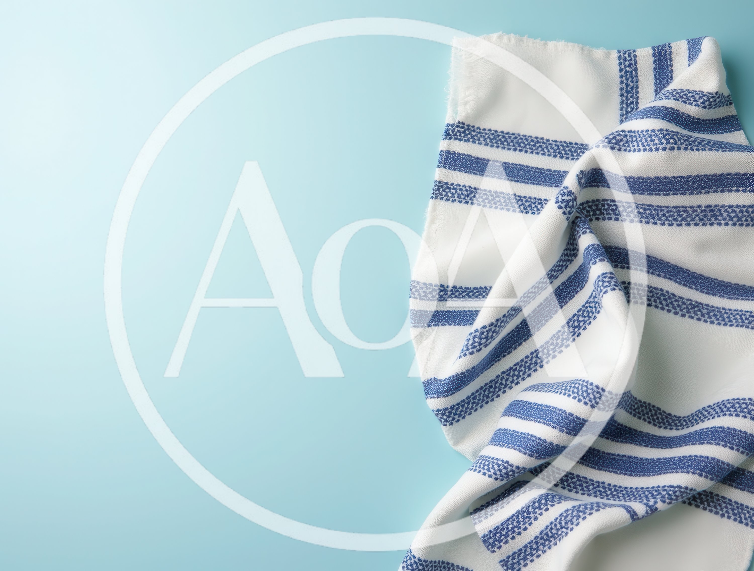 White Kitchen Towel With Blue Stripes On Light Blue Background