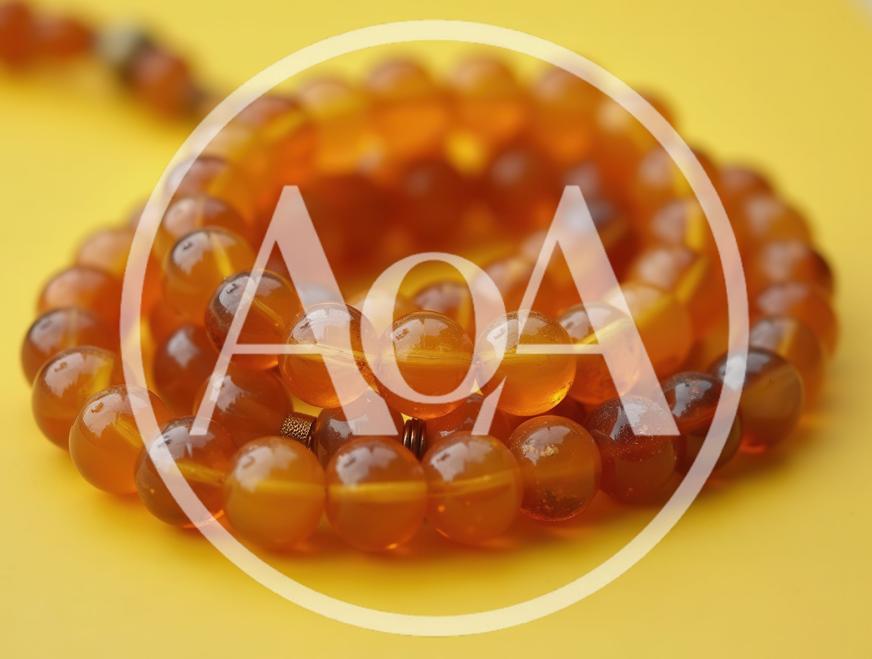 Amber Prayer Beads On A Yellow Background