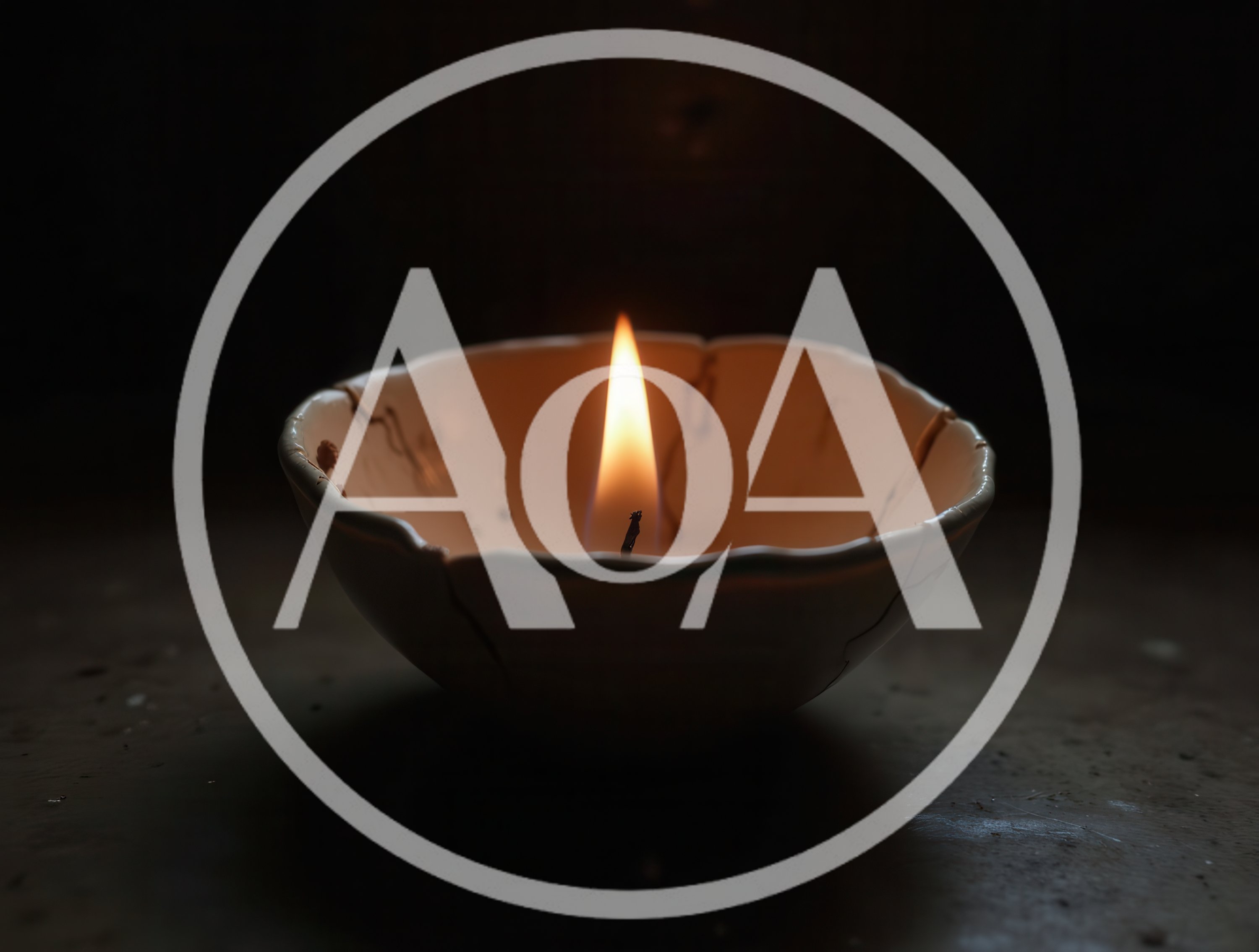 Lit Candle Inside A Cracked Ceramic Bowl