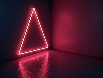 Neon Triangle Light Glowing In A Dark Corner