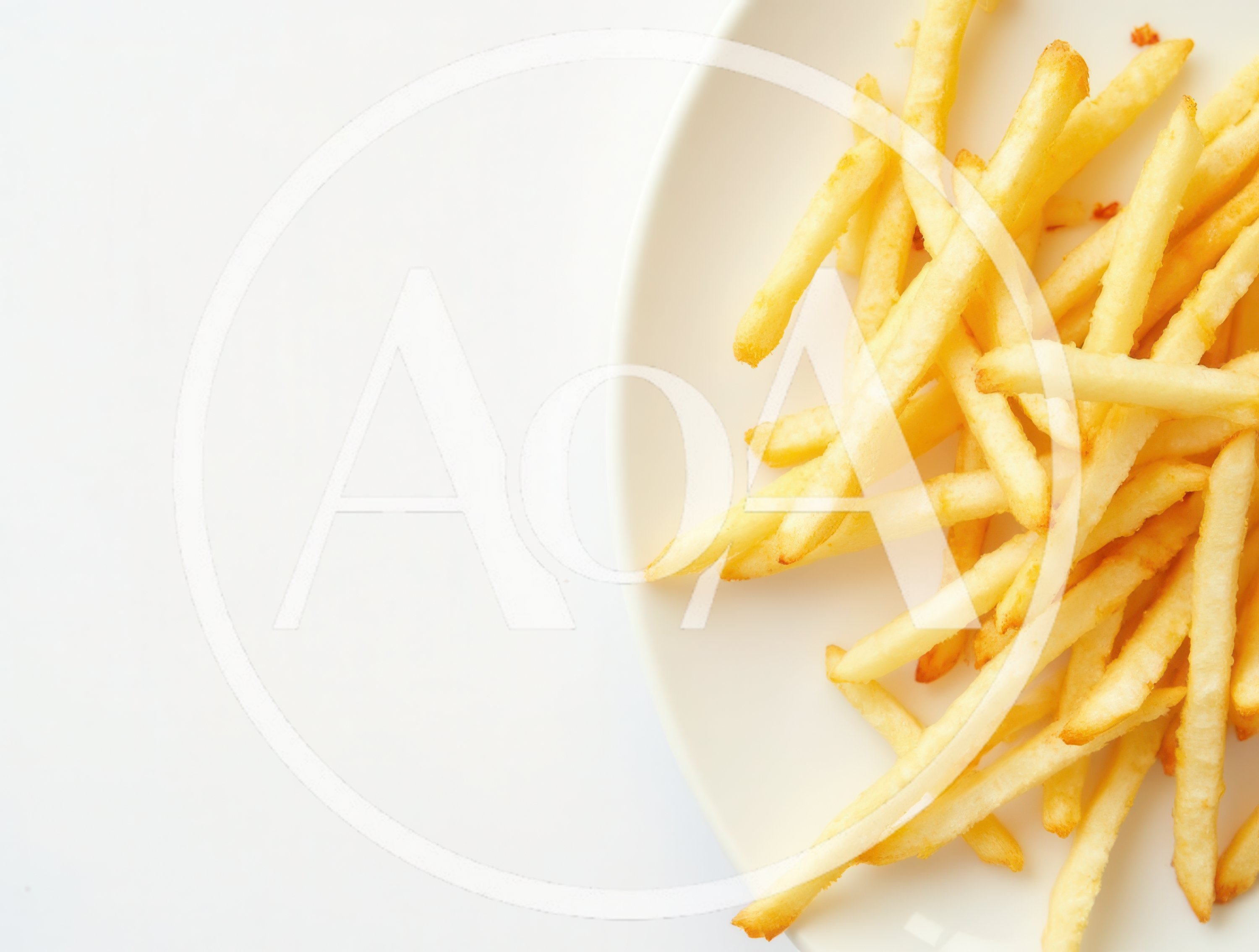 Golden Crispy French Fries On A White Plate