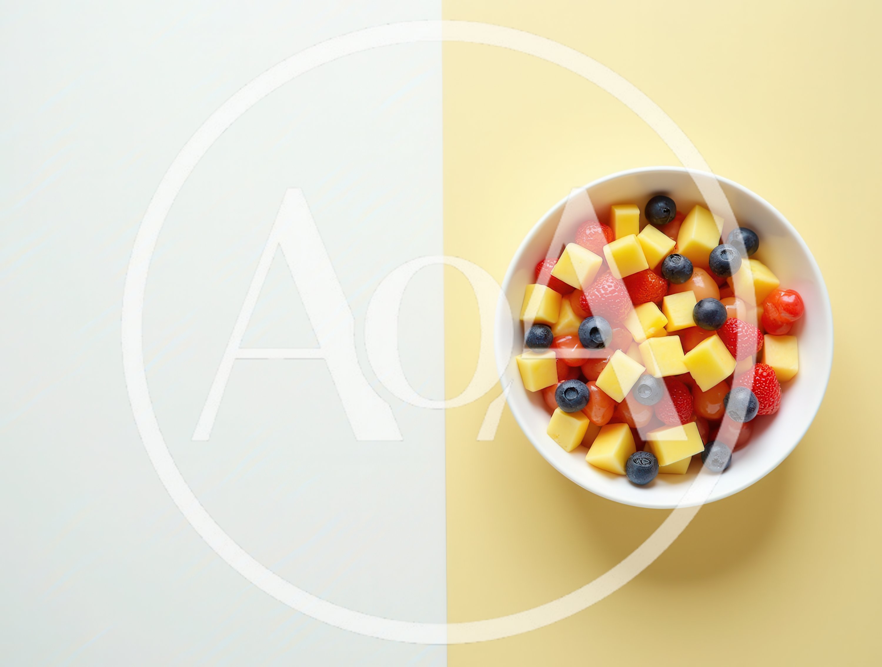 Bowl of Fresh Fruit Salad on Two Tone Background