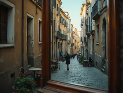 Woman Walking Down A Narrow Cobblestone Street In Italy