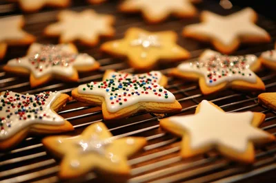 Star Shaped Christmas Cookies On A Cooling Rack