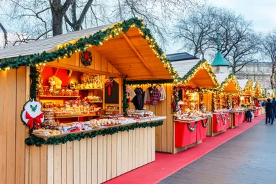 Festive Wooden Christmas Market Stalls Decorated With Lights