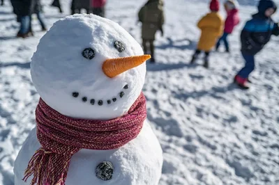 Close Up Of A Snowman With A Scarf