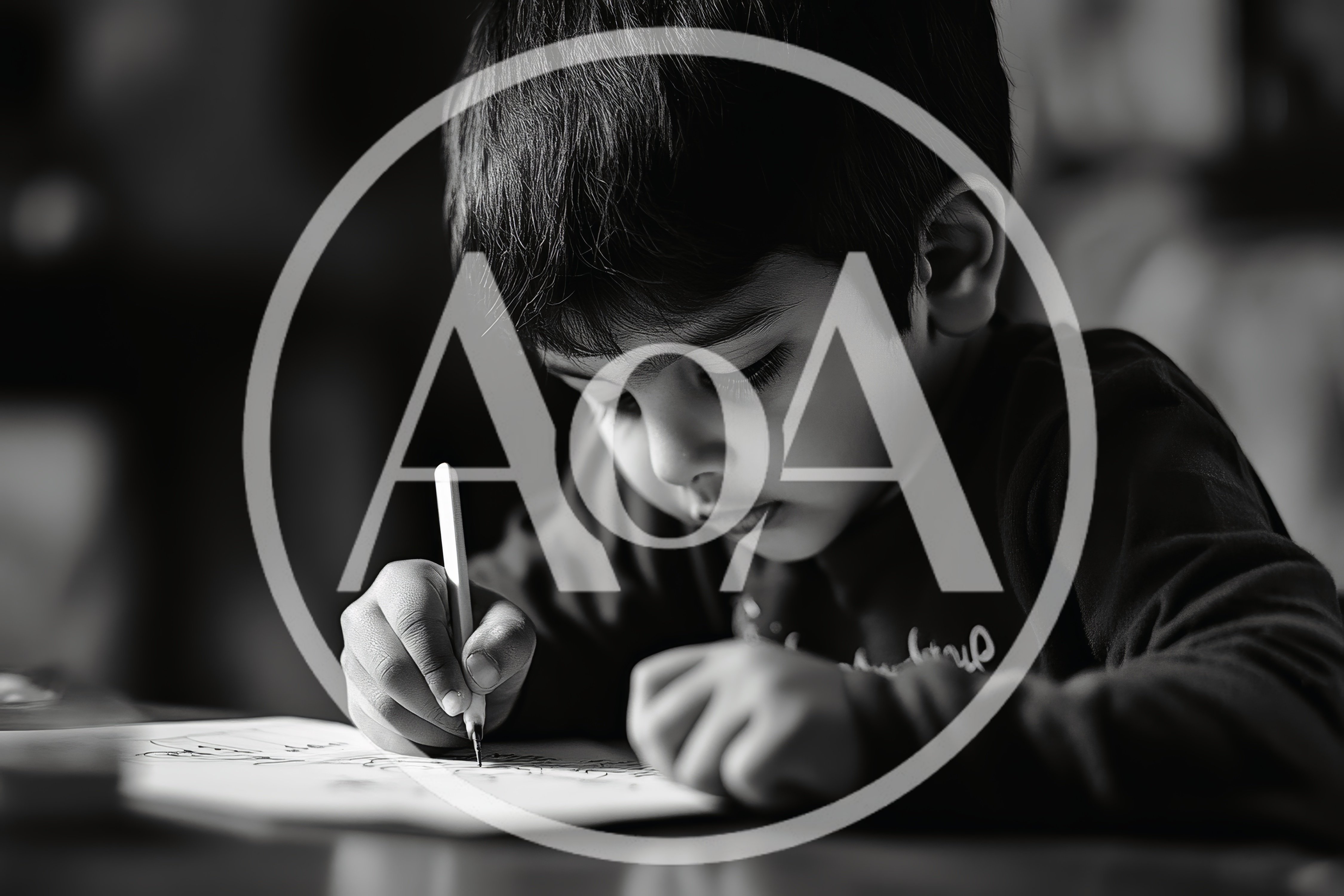 Young Boy Concentrating While Drawing On Paper