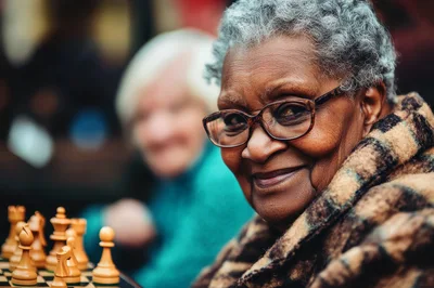 Elderly Woman Playing Chess With A Friend