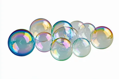 Group Of Iridescent Soap Bubbles Floating On White