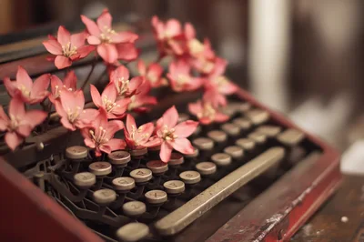 Vintage Typewriter Decorated With Pink Flowers