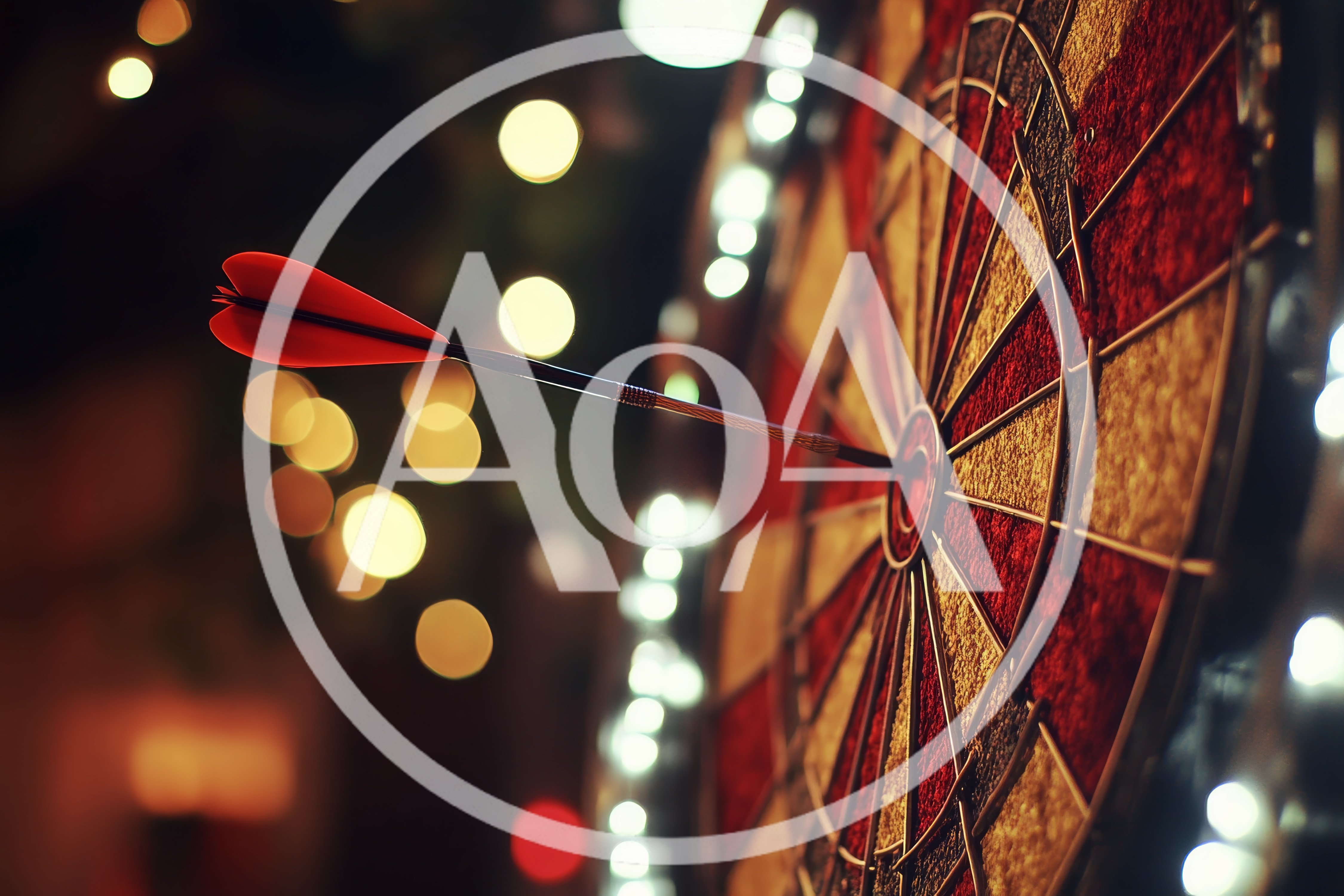 Red Dart Hitting The Bullseye On A Dartboard