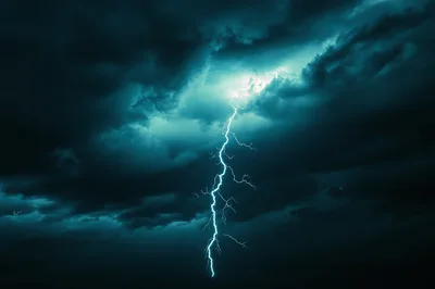 Dramatic Lightning Bolt Striking Through Dark Storm Clouds