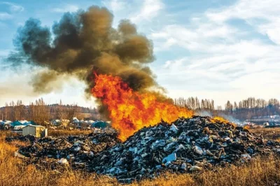 Large Garbage Dump Fire Burning With Thick Black Smoke