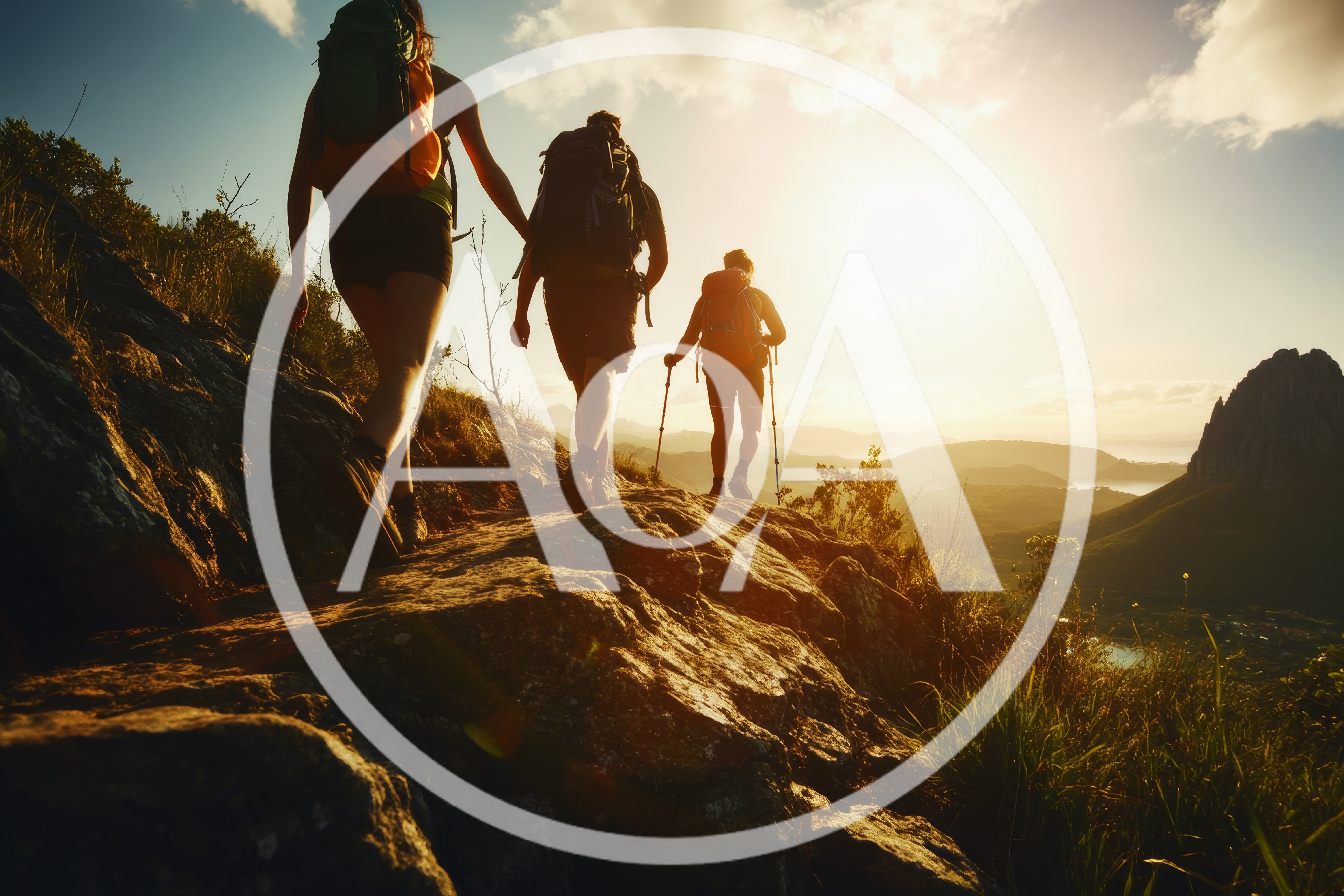 Three Hikers Trekking Along A Mountain Ridge At Sunset