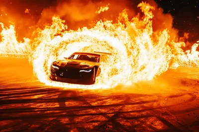 Sports Car Drifting Through A Ring Of Fire