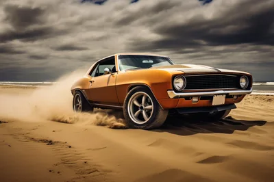 Classic Orange Muscle Car Driving On Sandy Beach