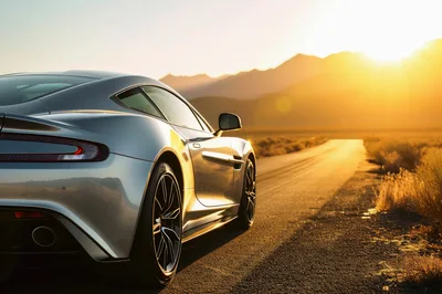 Silver Sports Car Parked on Desert Road at Sunset