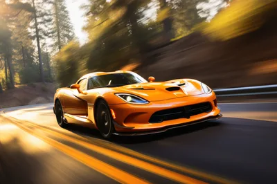 Orange Dodge Viper Driving Fast On A Forest Road