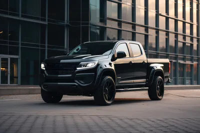 Black Pickup Truck Parked Outside Modern Glass Building