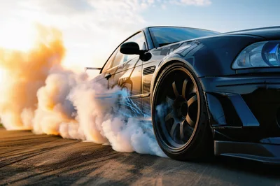 Black Sports Car Performing A Drift Burnout