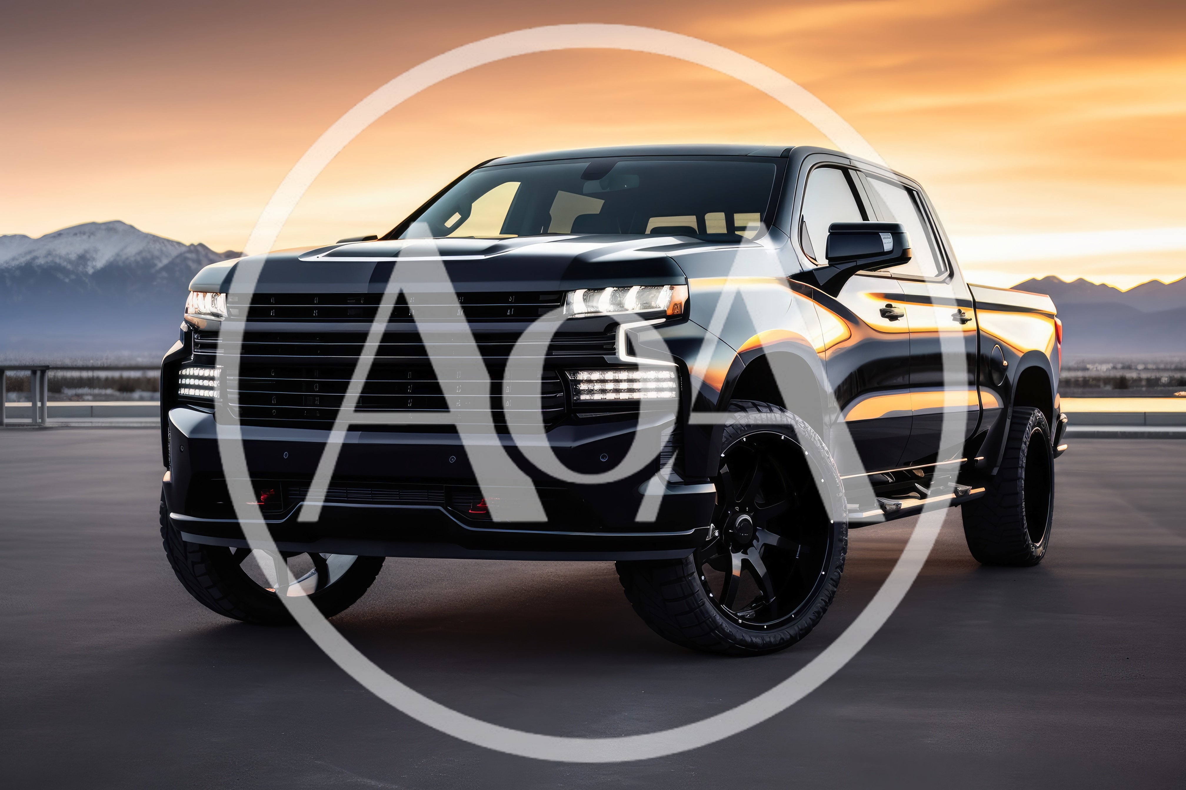 Black Pickup Truck Parked Against Sunset Mountain Backdrop