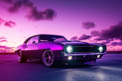 Classic Muscle Car Under Vibrant Purple Sunset Sky